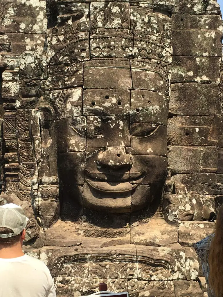 Smiling Buddha head on the temple in Siem Reap, Cambodia